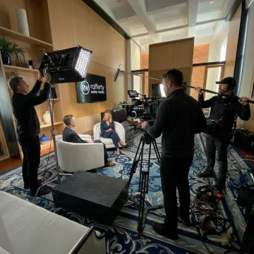 Corporate video crew filming an executive interview