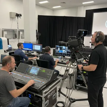 Production team managing a hybrid event control station