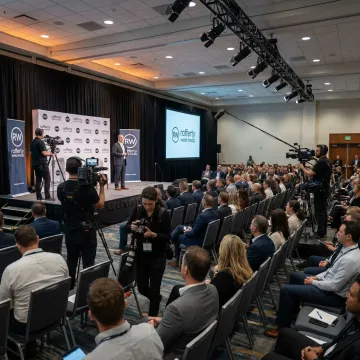 Corporate event photographer capturing a conference presentation