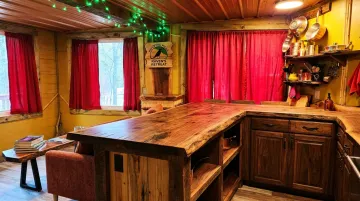 Dustin Weatherby handcrafted wood sculpture integrated into Raven's Retreat lodge interior