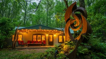 Raven's Retreat Hocking Hills art bungalow forest setting with sculpture installations