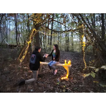 Couple planning an outdoor forest wedding