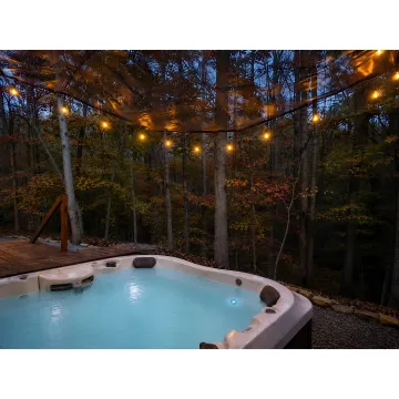 Massage and hot tub setup at a forest spa retreat