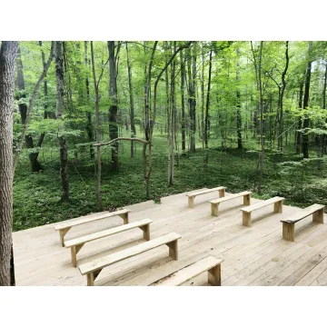 Couple planning a forest elopement with a retreat host
