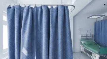 Hospital privacy curtain close-up showing fabric material used in patient bay