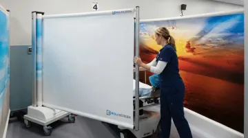 Rolascreen retractable medical privacy screen deployed in hospital patient bay setting