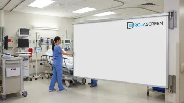 Rolascreen retractable wall-mounted privacy screen extended in hospital bay