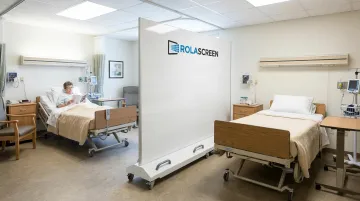 Portable retractable privacy screen dividing shared resident room in long-term care facility