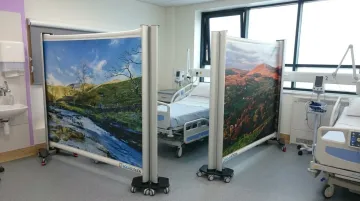 Rolascreen retractable medical privacy screen deployed in hospital patient bay