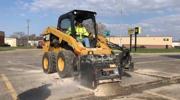 Rolling Wedge milling attachment mounted on skidsteer loader