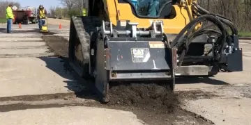 Rolling Wedge milling attachment drum installed on skidsteer