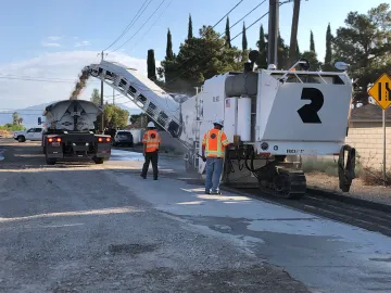 Rolling Wedge Milling Tool cutting through mixed concrete and asphalt surface