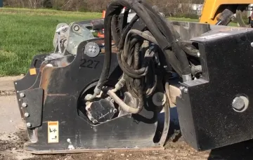 Rolling Wedge RW103-B milling attachment removing asphalt driveway surface