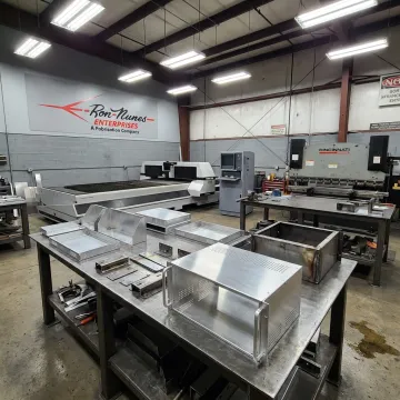 Precision metal fabrication shop with fabricated chassis parts