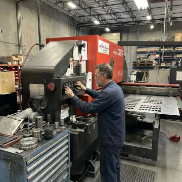 N/C punching process in a metal fabrication shop