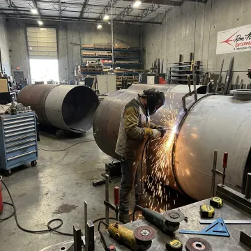 Steel tank welding in fabrication shop