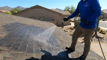 Roof Guard Pro technician applying GoNano Shingle Saver protective coating treatment