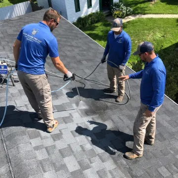 Roof coating application on asphalt shingles