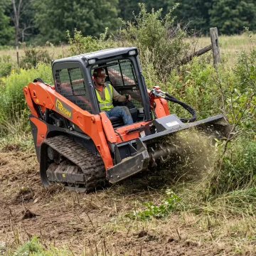 Skid steer operating a brush cutter attachment