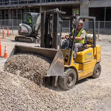 Heavy duty forklift bucket attachment at a jobsite