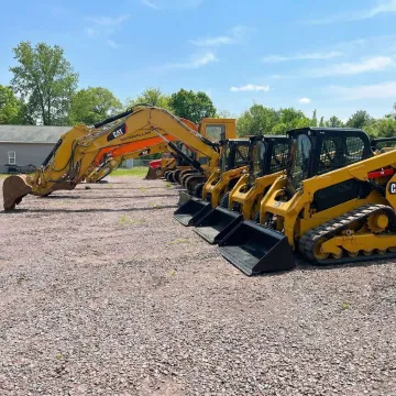 Well-maintained excavator and construction equipment at Rossini Equipment Corp yard