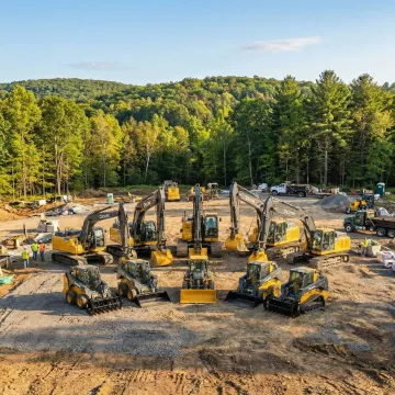 Heavy construction excavator and skid steer equipment on a Grahamsville NY jobsite