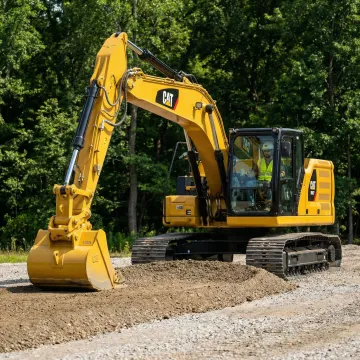 Construction site with excavator performing grading work