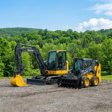 Well-maintained excavator and skid steer at Sullivan County construction yard