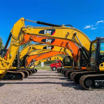 Well-maintained excavator and construction equipment at Rossini Equipment Corp yard in Monticello