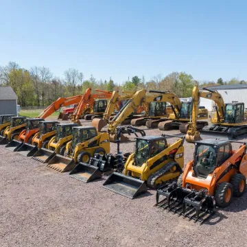 Fleet of maintained excavators and heavy equipment at Rossini Equipment yard