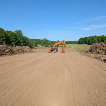 Cleared construction site with graded land ready for building