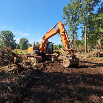 Residential land clearing and excavation crew at work