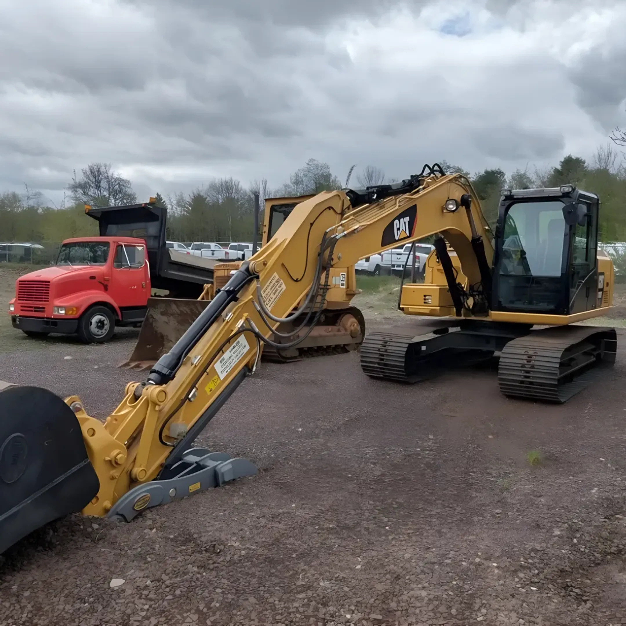 Heavy construction equipment including earthmoving machines and skid steers at a job site in Monticello NY