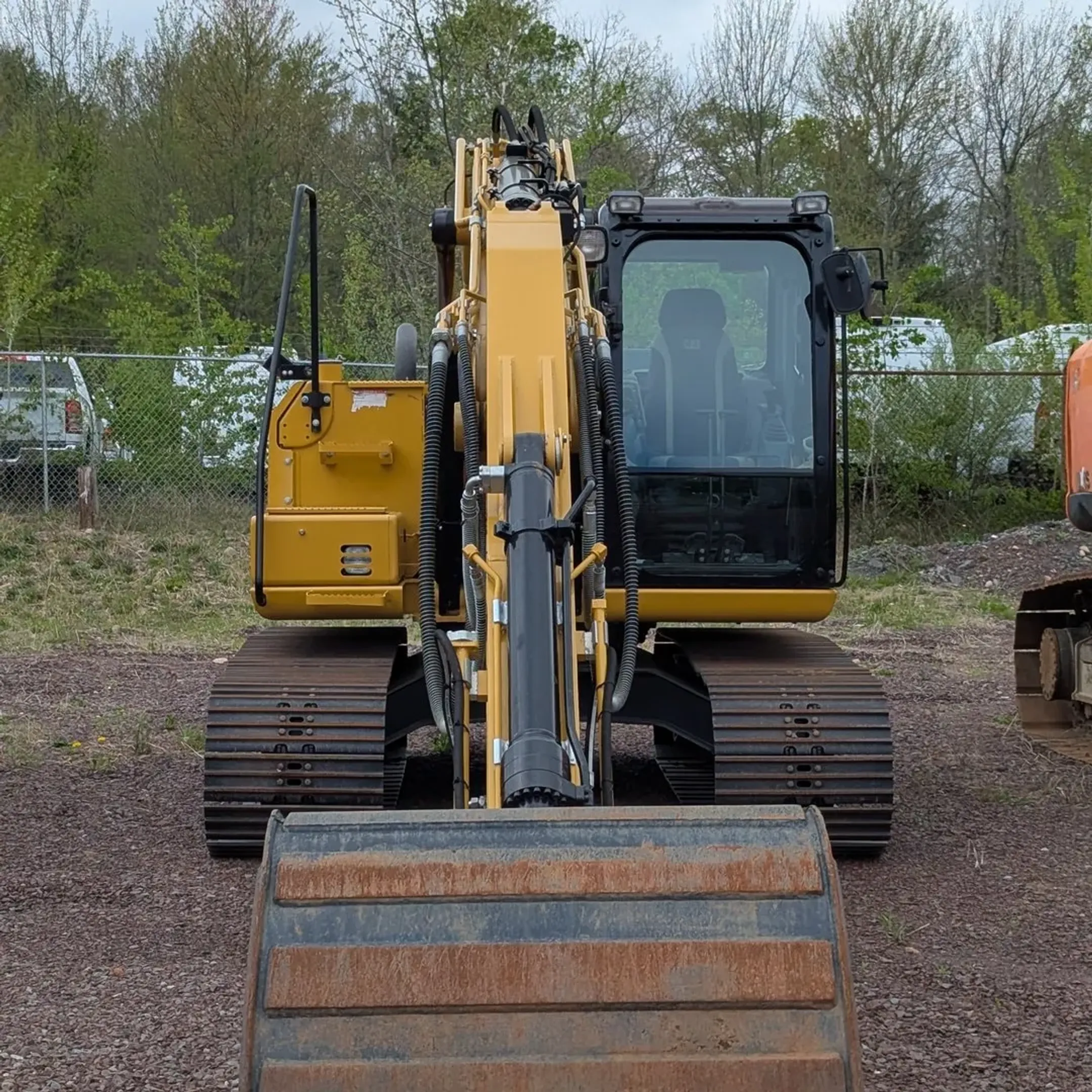 Heavy construction equipment including earthmoving machines and skid steers at a job site in Mamakating NY