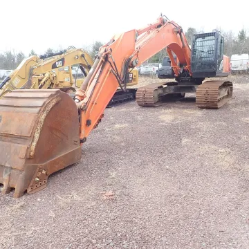 Construction crew running a rented earthmoving machine on Sullivan County site