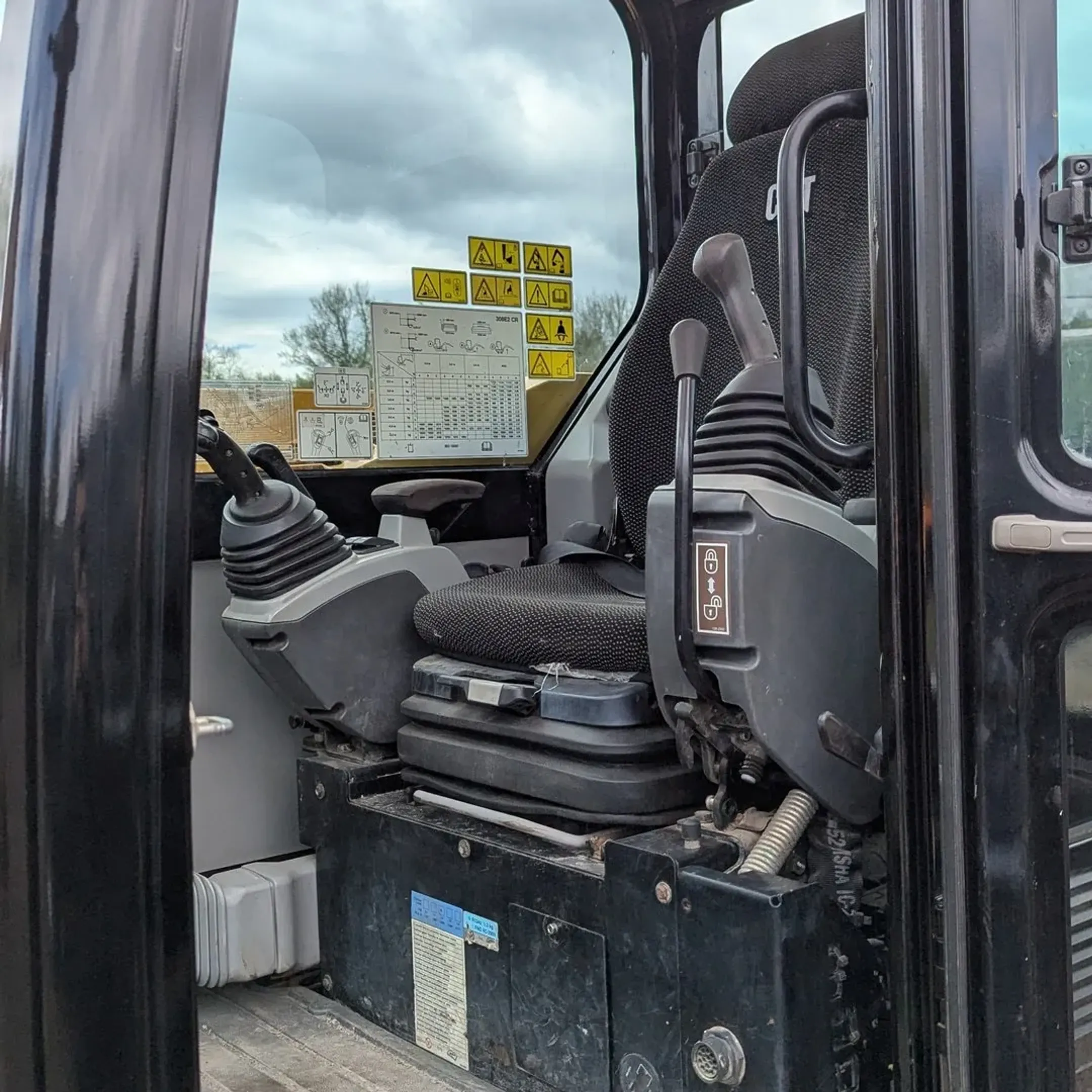 Heavy construction equipment including excavators and skid steers ready for rental