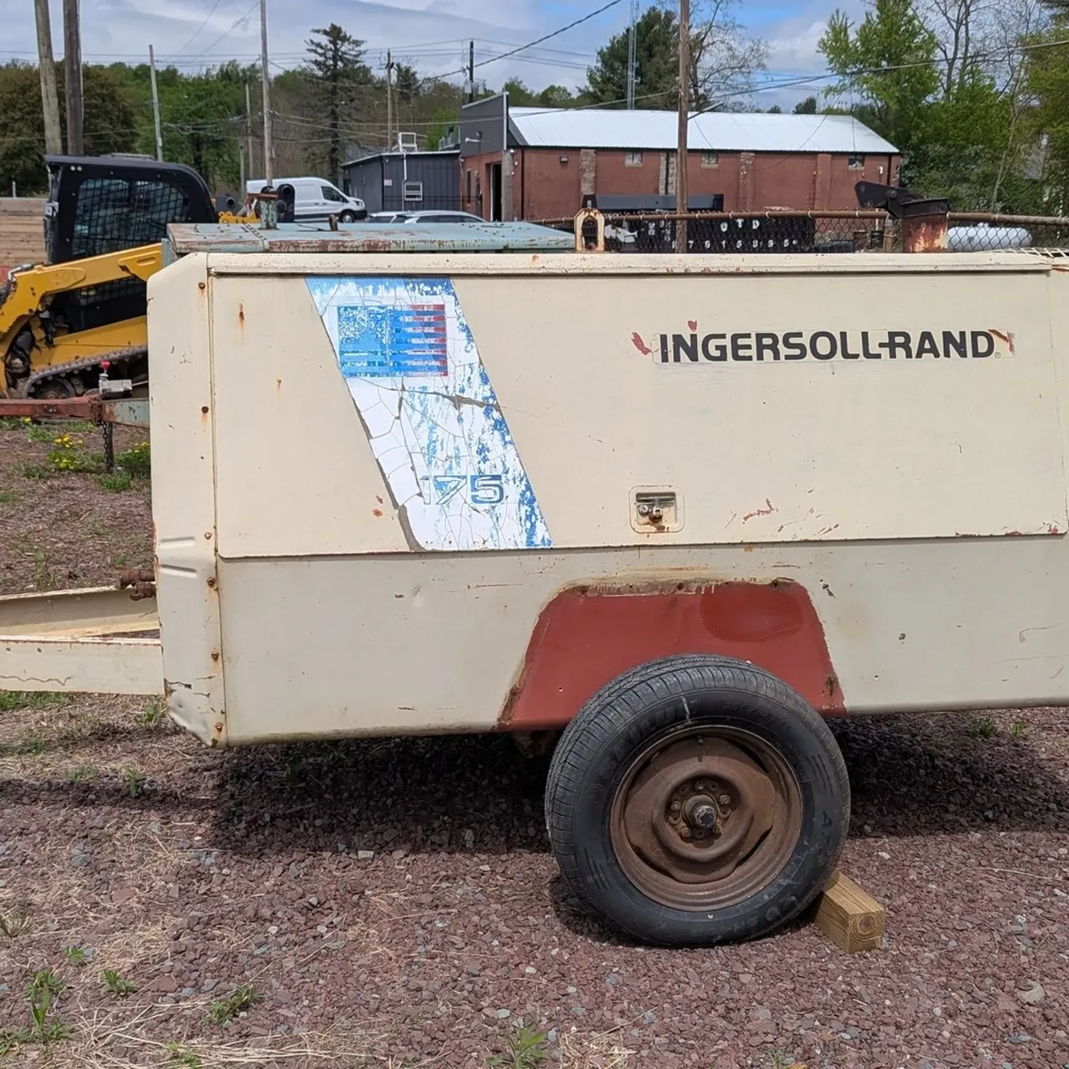 Heavy construction earthmoving machine and skid steer equipment on Sullivan County job site