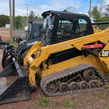 Construction equipment operator using excavator for site preparation work in Sullivan County NY