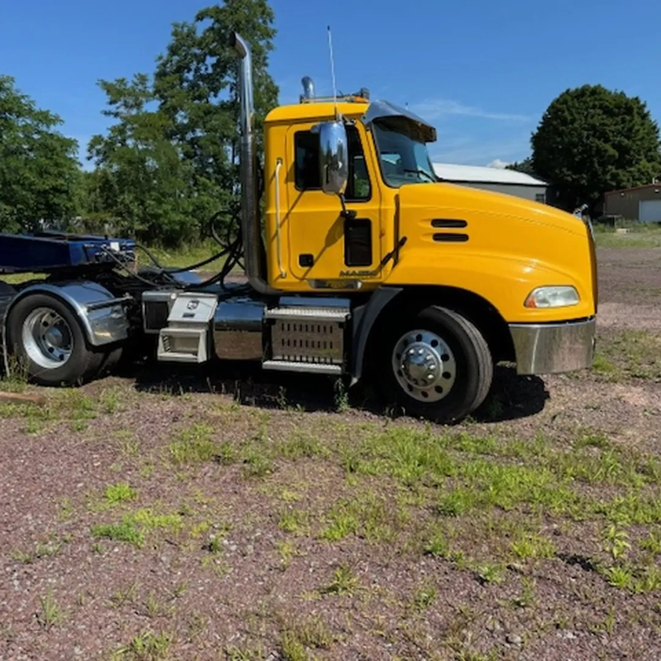 Heavy earthmoving machine and skid steer on Thompson NY construction site