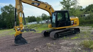 Rossini Equipment Corp transportation team delivering excavator to job site