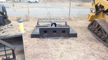 Used skid steer engine compartment inspection showing key components and connections