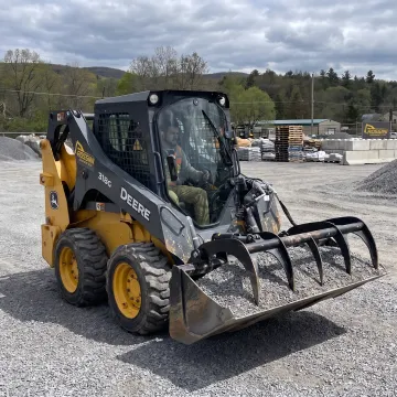 Skid steer loader working at a jobsite