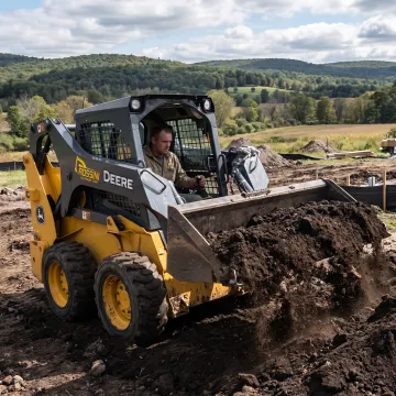 Skid steer loader using a heavy-duty bucket