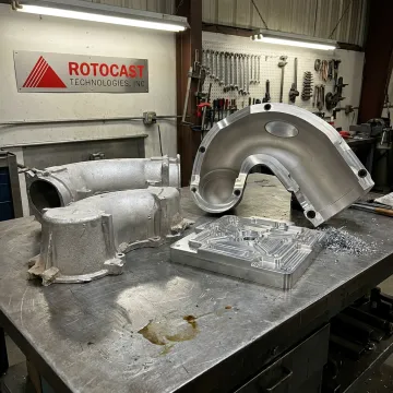 Precision aluminum cast components and tooling on foundry workbench