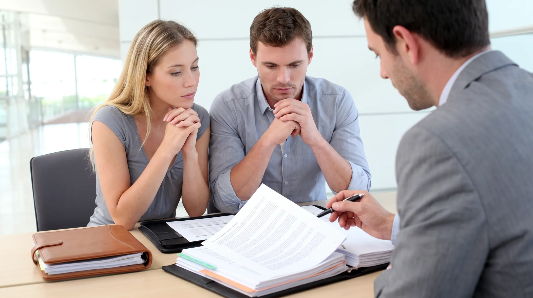 Business valuation advisors reviewing confidential owner financial documents