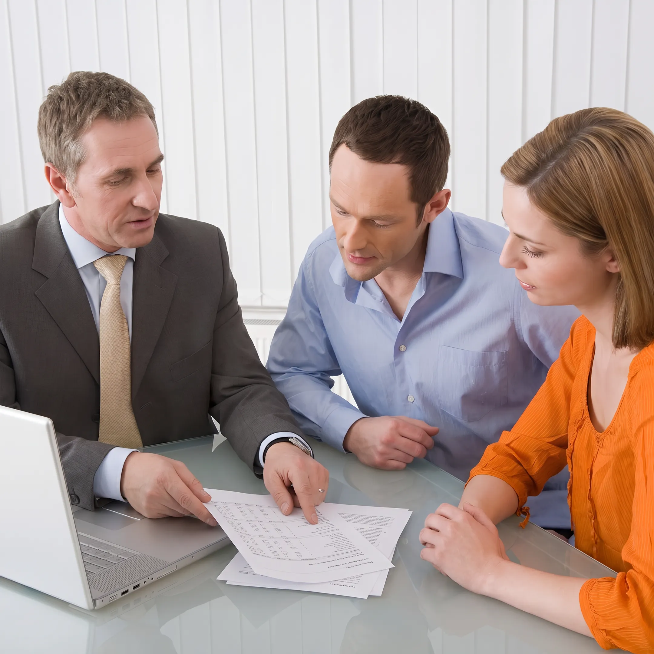 Certified business broker reviewing financial documents with a business owner