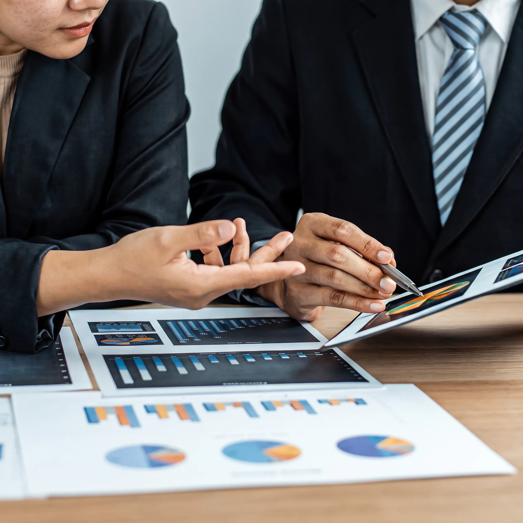 Business advisor reviewing company valuation documents with an owner