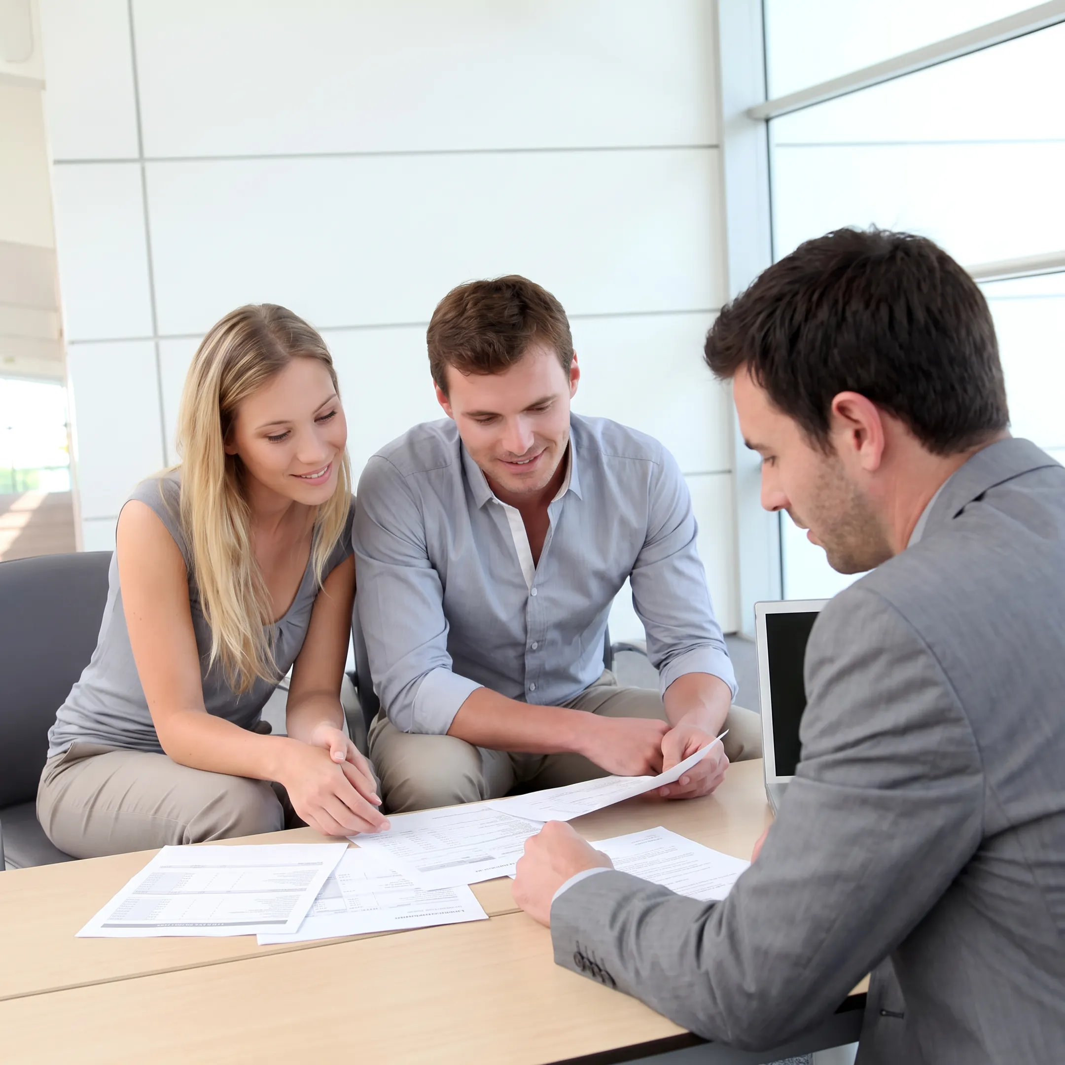 Business broker reviewing financial documents with a business owner