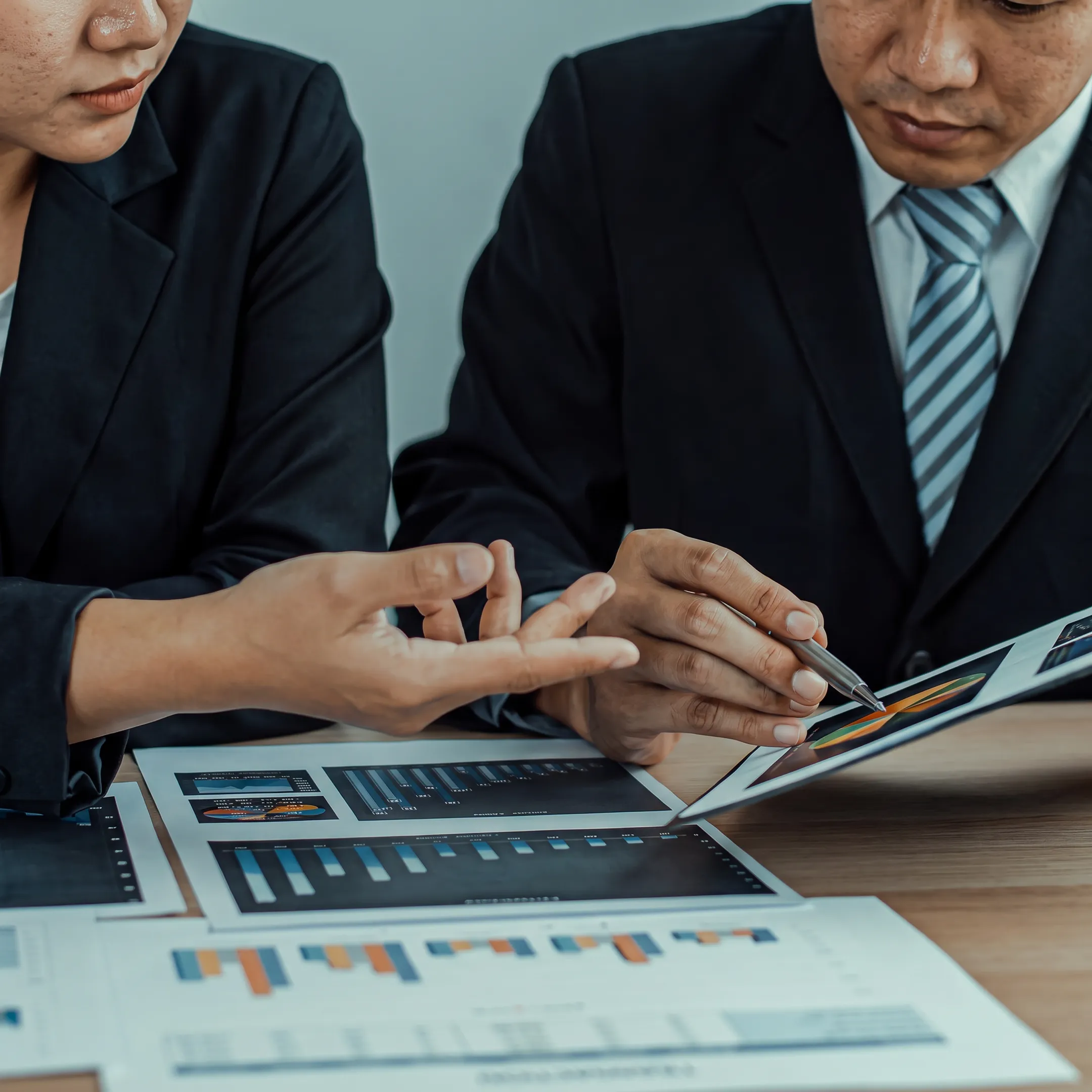 Business advisor presenting a valuation analysis to a business owner