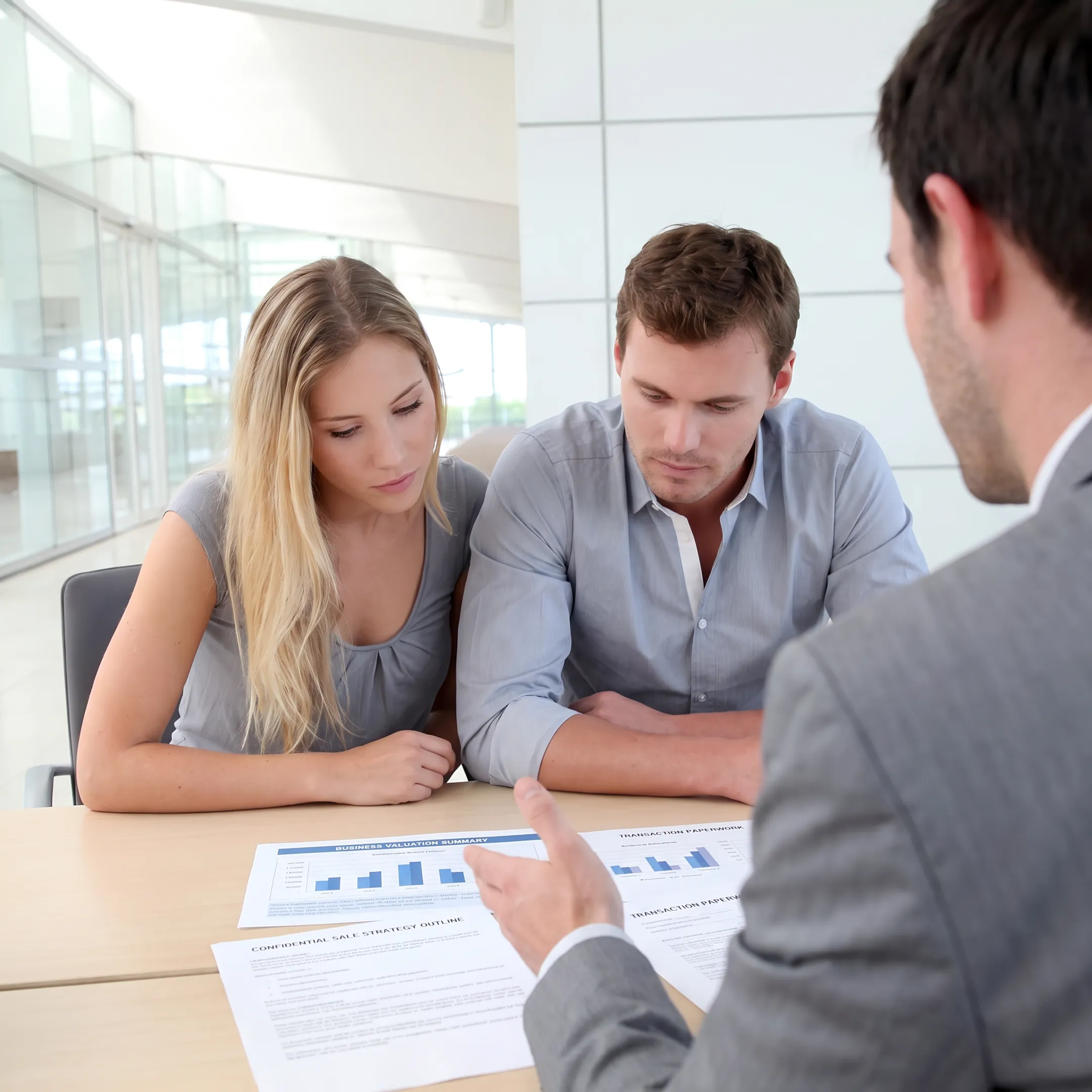 Business broker discussing valuation and transaction strategy with a company owner